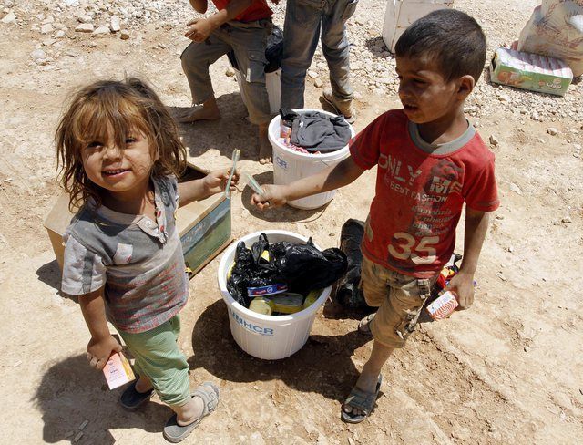 Des enfants syriens pris en photo dans un camp de réfugiés de Jordanie, le 11 août dernier. 